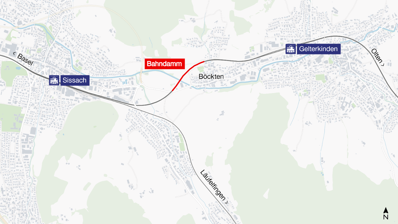 Die Grafik zeigt auf einer Karte rot eingezeichnet, wo sich der Bahndamm befindet. Links von ihm liegt blau eingezeichnet der Bahnhof Sissach, rechts blau eingezeichnet der Bahnhof Gelterkinden.