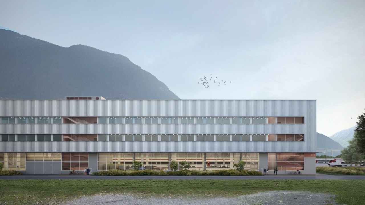 Visualizzazione della facciata esterna lato ovest, dove ci saranno alcuni spazi verdi. Si vedono le ampie finestre, sia della parte di produzione a piano terra, sia della parte dedicata agli uffici dei piani superiori.